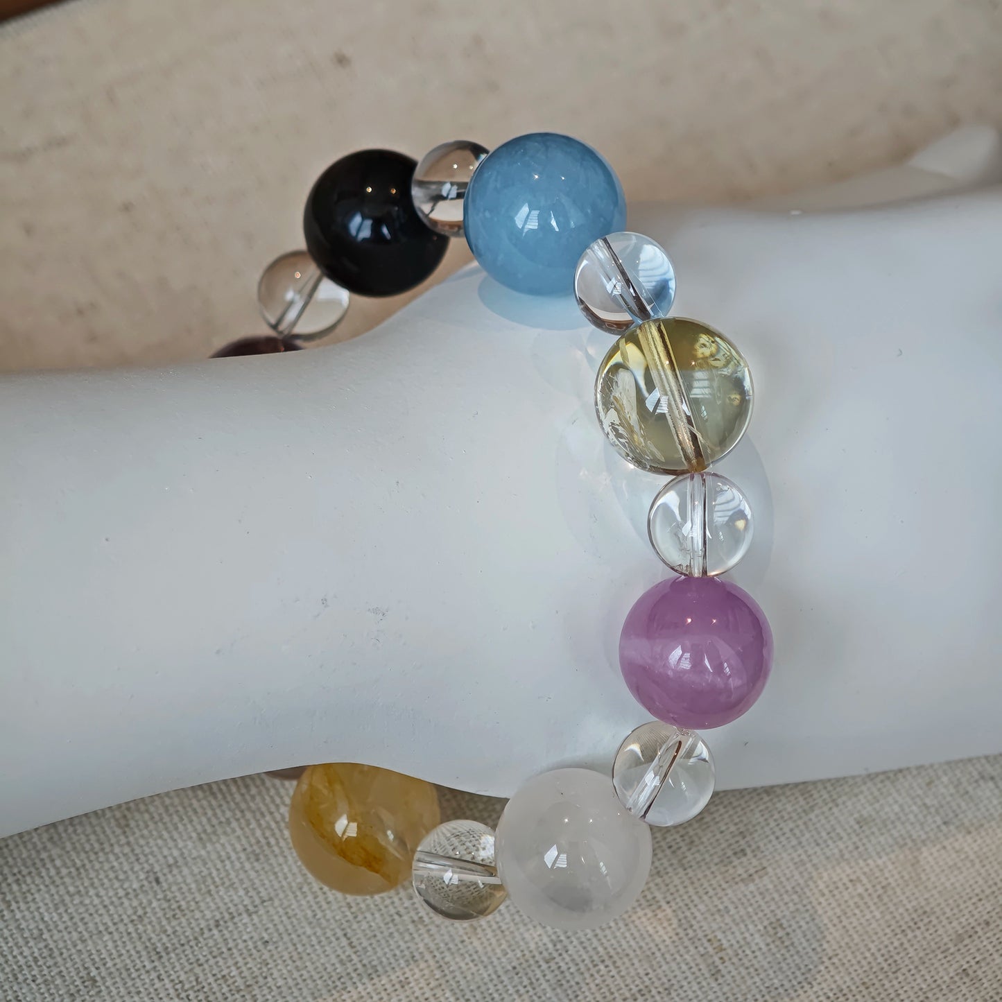 This is a multi-gemstone bracelets consists of Aquamarine, Amethyst, Citrine and White Phantom, etc.
