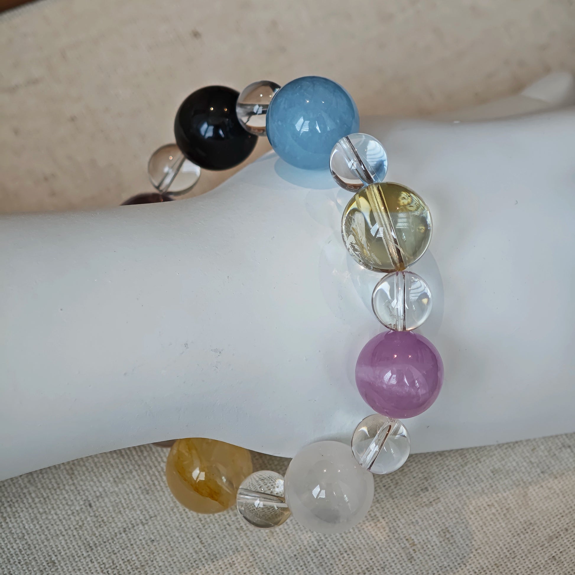 This is a multi-gemstone bracelets consists of Aquamarine, Amethyst, Citrine and White Phantom, etc.