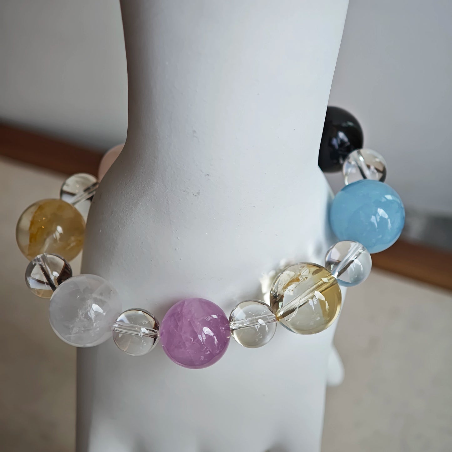 This is a multi-gemstone bracelets consists of Aquamarine, Amethyst, Citrine and White Phantom, etc.