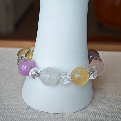 This is a multi-gemstone bracelets consists of Aquamarine, Amethyst, Citrine and White Phantom, etc.