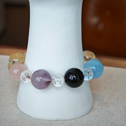 This is a multi-gemstone bracelets consists of Aquamarine, Amethyst, Citrine and White Phantom, etc.