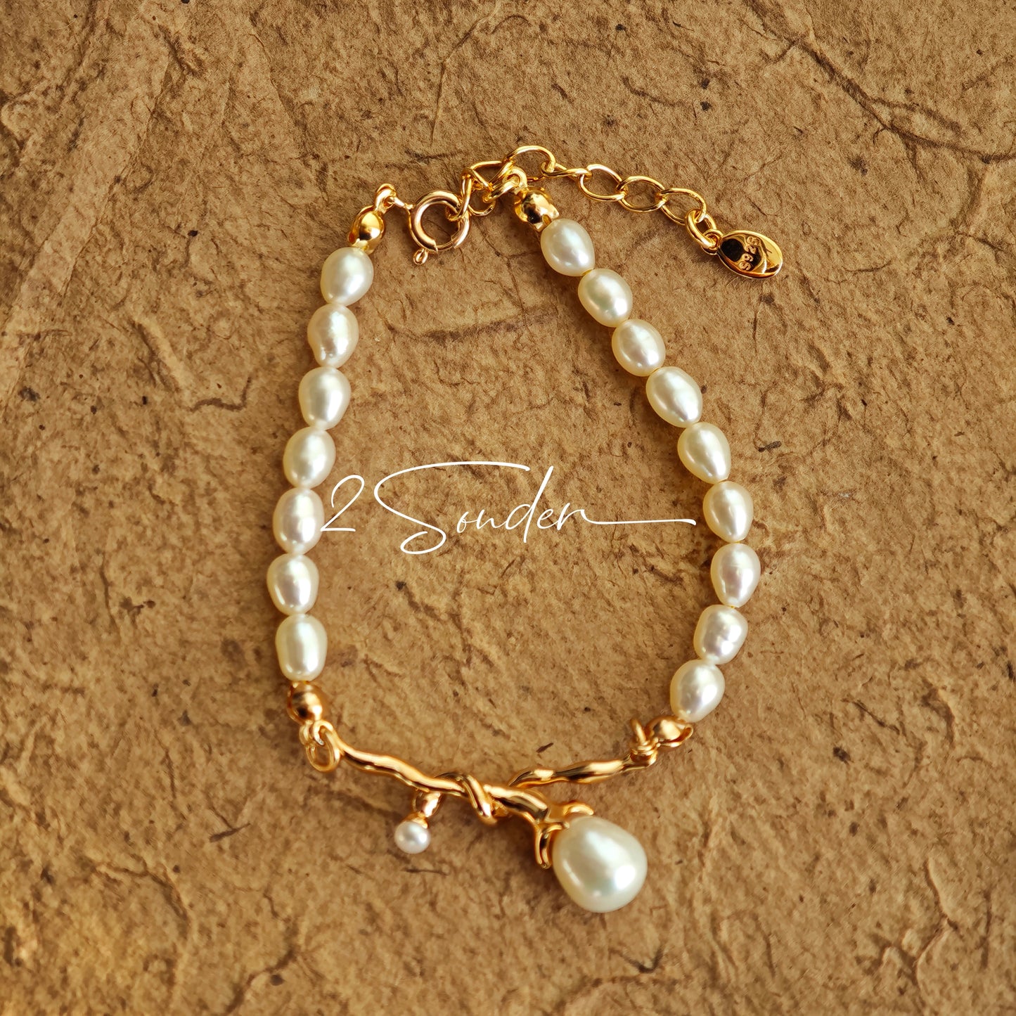 This bracelet is inspired by the romantic concept of "intertwined destiny," the vintage gold color sterling silver gently wraps together like vines. The end of the vines are plated lustrous Freshwater Pearls, symbolizing the beautiful bonds of life.