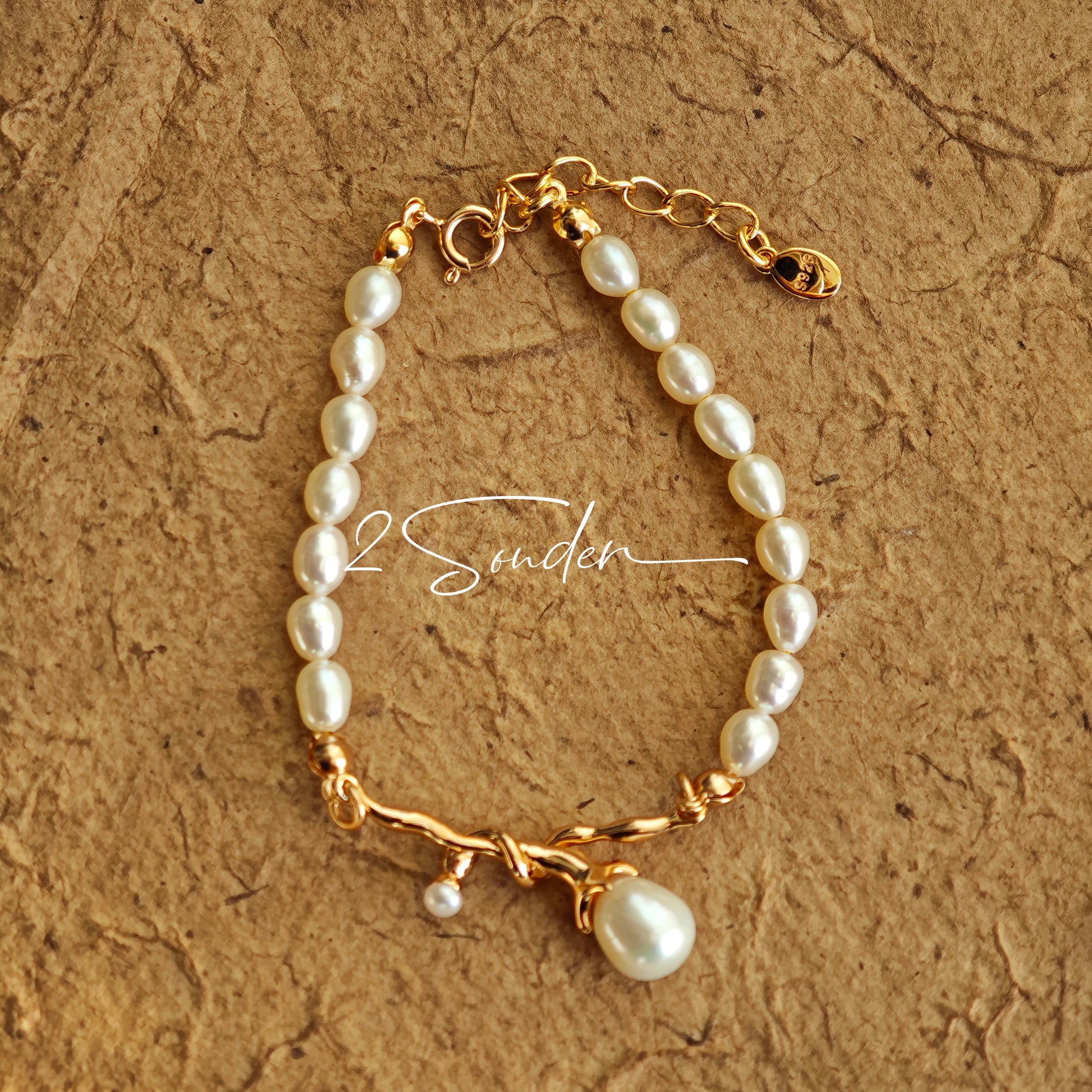 This bracelet is inspired by the romantic concept of "intertwined destiny," the vintage gold color sterling silver gently wraps together like vines. The end of the vines are plated lustrous Freshwater Pearls, symbolizing the beautiful bonds of life.