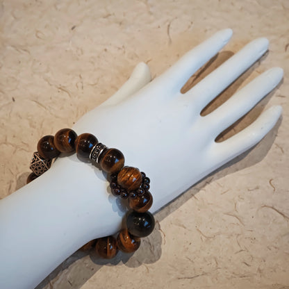 A handmade bracelet with Tiger's Eyes, Silver Sheen Obsidian and Garnet.