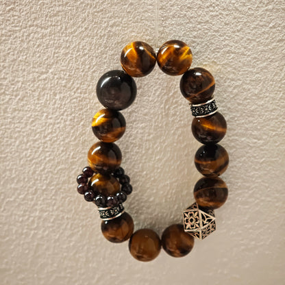 A handmade bracelet with Tiger's Eyes, Silver Sheen Obsidian and Garnet.