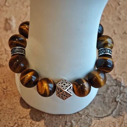 A handmade bracelet with Tiger's Eyes, Silver Sheen Obsidian and Garnet.