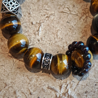 A handmade bracelet with Tiger's Eyes, Silver Sheen Obsidian and Garnet.