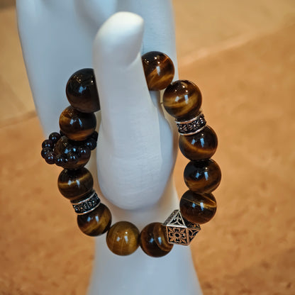 A handmade bracelet with Tiger's Eyes, Silver Sheen Obsidian and Garnet.