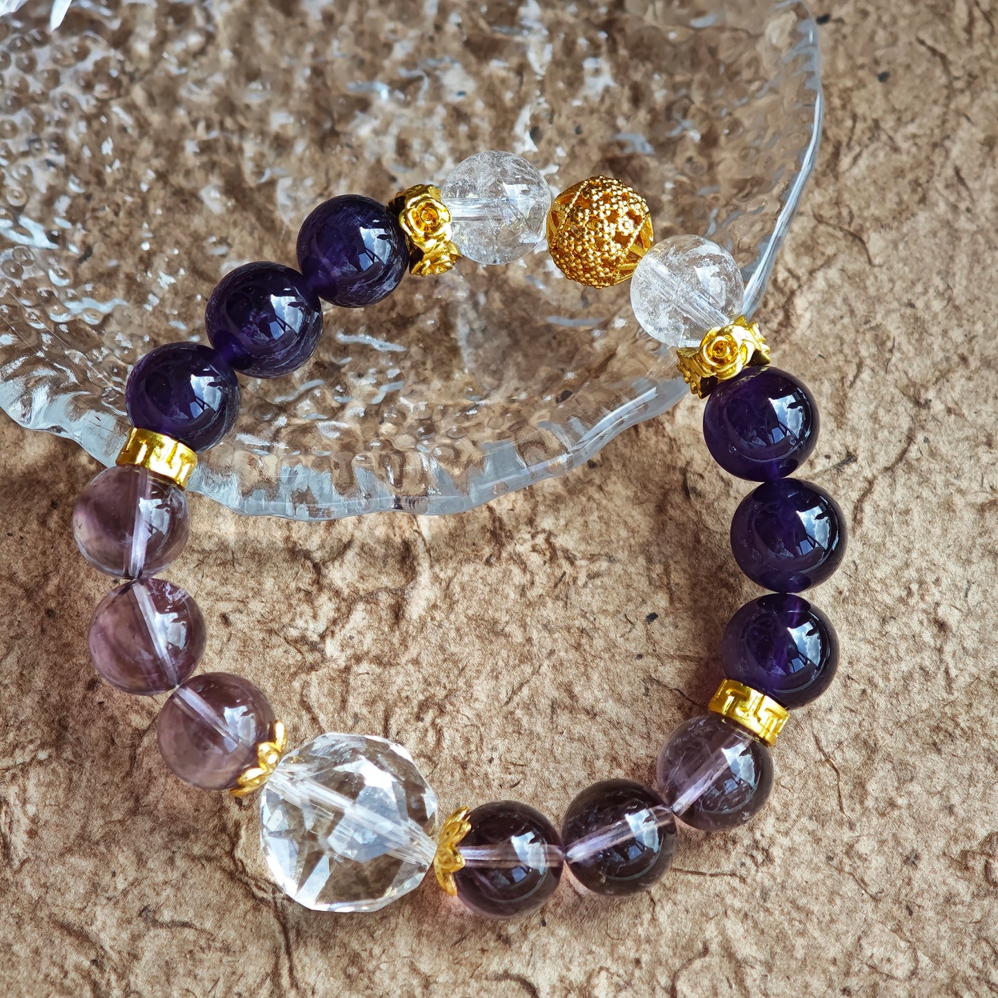 This is a amethyst bracelet consists of Brazilian & Uruguayan amethyst, as well as clear quartz.