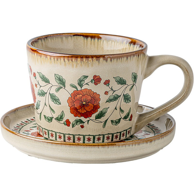 This is a vintage ceramic coffee cup and saucer set with retro floral patterns. The cup capacity is 385ml, and it comes with a saucer. This mid-century inspired ceramic coffee mug set features high-temperature decal floral patterns, kiln-change glaze effects, and elegant gold detailing.