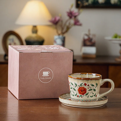 This is a vintage ceramic coffee cup and saucer set with retro floral patterns. The cup capacity is 385ml, and it comes with a saucer. This mid-century inspired ceramic coffee mug set features high-temperature decal floral patterns, kiln-change glaze effects, and elegant gold detailing.
