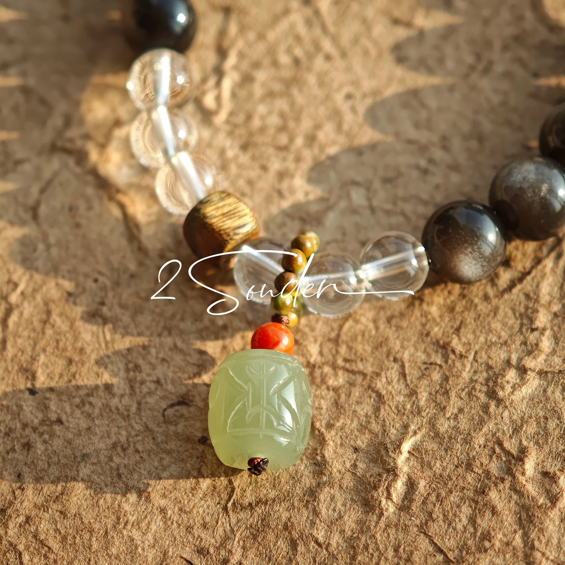 This bracelet combines genuine Silver Obsidian (look for the subtle silver sheen under light), high-clarity White Quartz, and Real Agarwood. Unlike synthetic imitations, our Agarwood carries a faint, natural woody scent that deepens over time. Plus, there is an Agate ring in the bracelet, which adds a touch of classical beauty. It feels grounded and real on your skin.