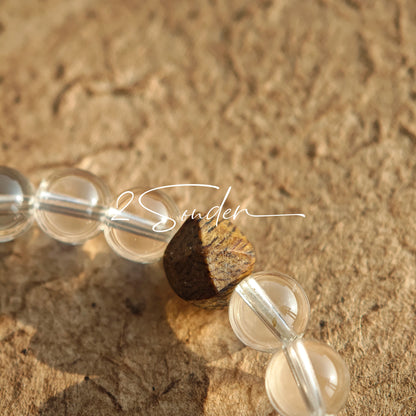 This bracelet combines genuine Silver Obsidian (look for the subtle silver sheen under light), high-clarity White Quartz, and Real Agarwood. Unlike synthetic imitations, our Agarwood carries a faint, natural woody scent that deepens over time. Plus, there is an Agate ring in the bracelet, which adds a touch of classical beauty. It feels grounded and real on your skin.