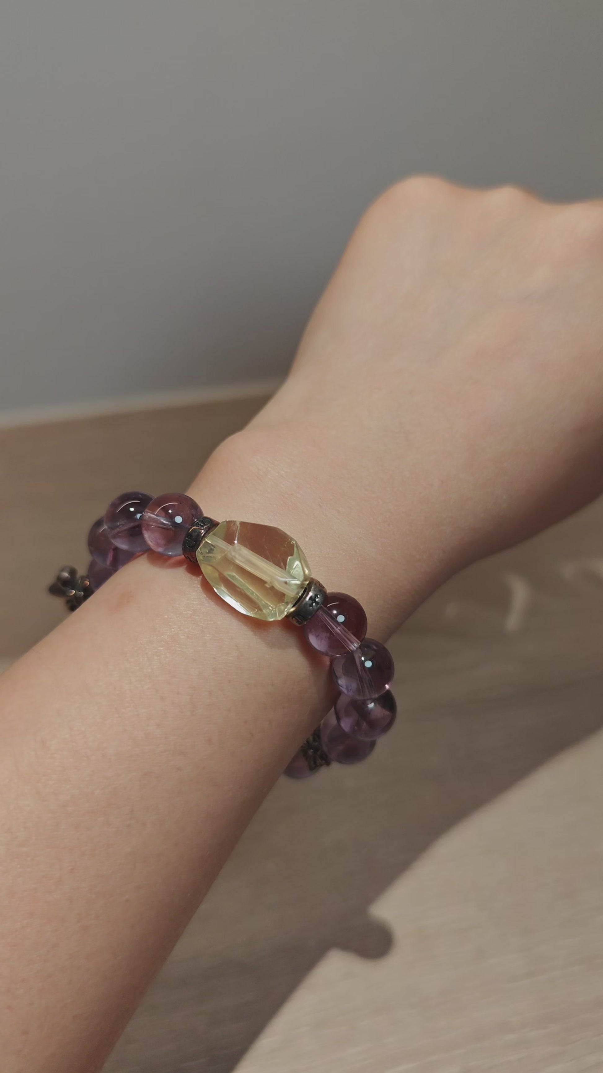 This is a crystal bracelet that consists of amethyst, citrine and chrome hearts spacers.