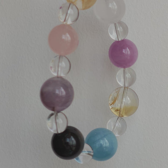 This is a multi-gemstone bracelets consists of Aquamarine, Amethyst, Citrine and White Phantom, etc.
