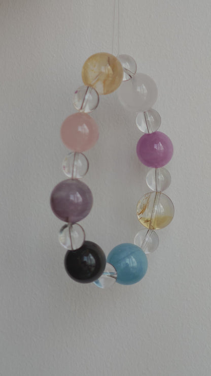 This is a multi-gemstone bracelets consists of Aquamarine, Amethyst, Citrine and White Phantom, etc.