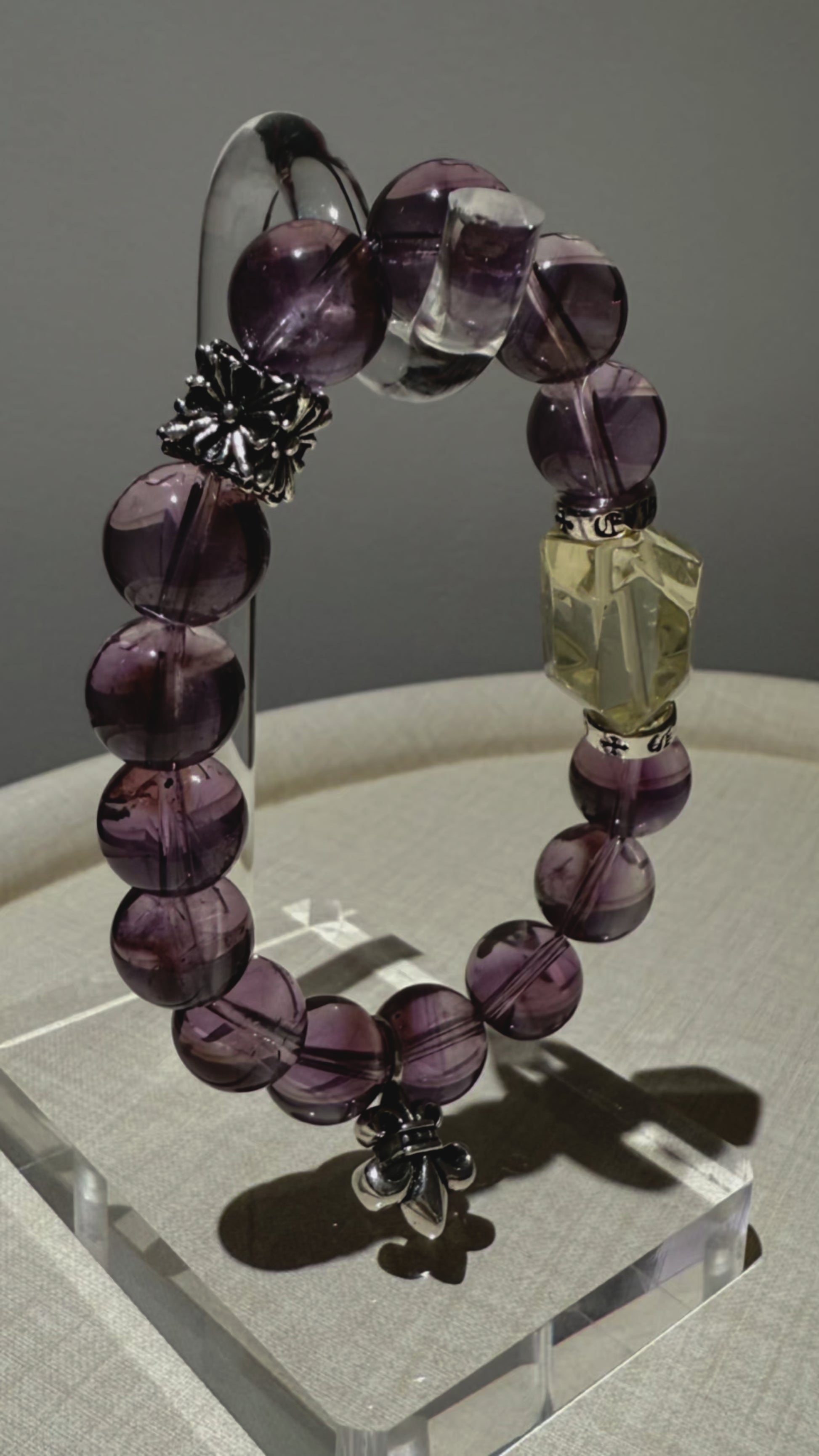 This is a crystal bracelet that consists of amethyst, citrine and chrome hearts spacers.