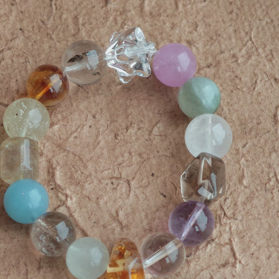 Soft blues, royal purples, warm golds, gentle greens, and misty whites glide like watercolor on silk.