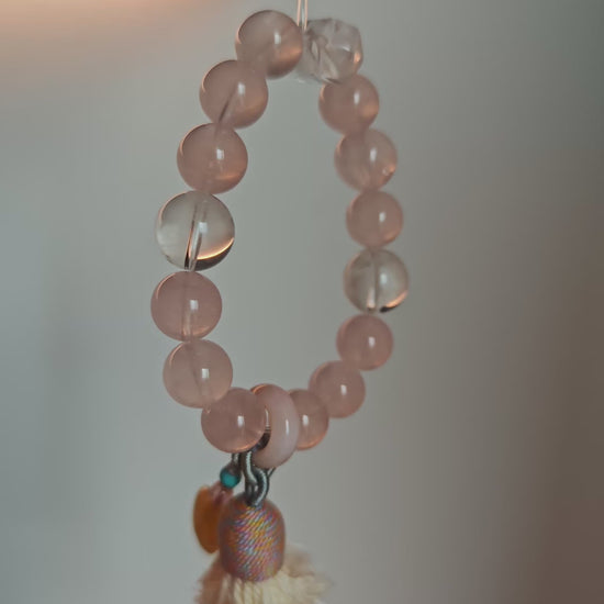A dreamy blend of pink love and blue wonder, sealed with an amber star, sliding agate bead, and fluttering tassel charm.