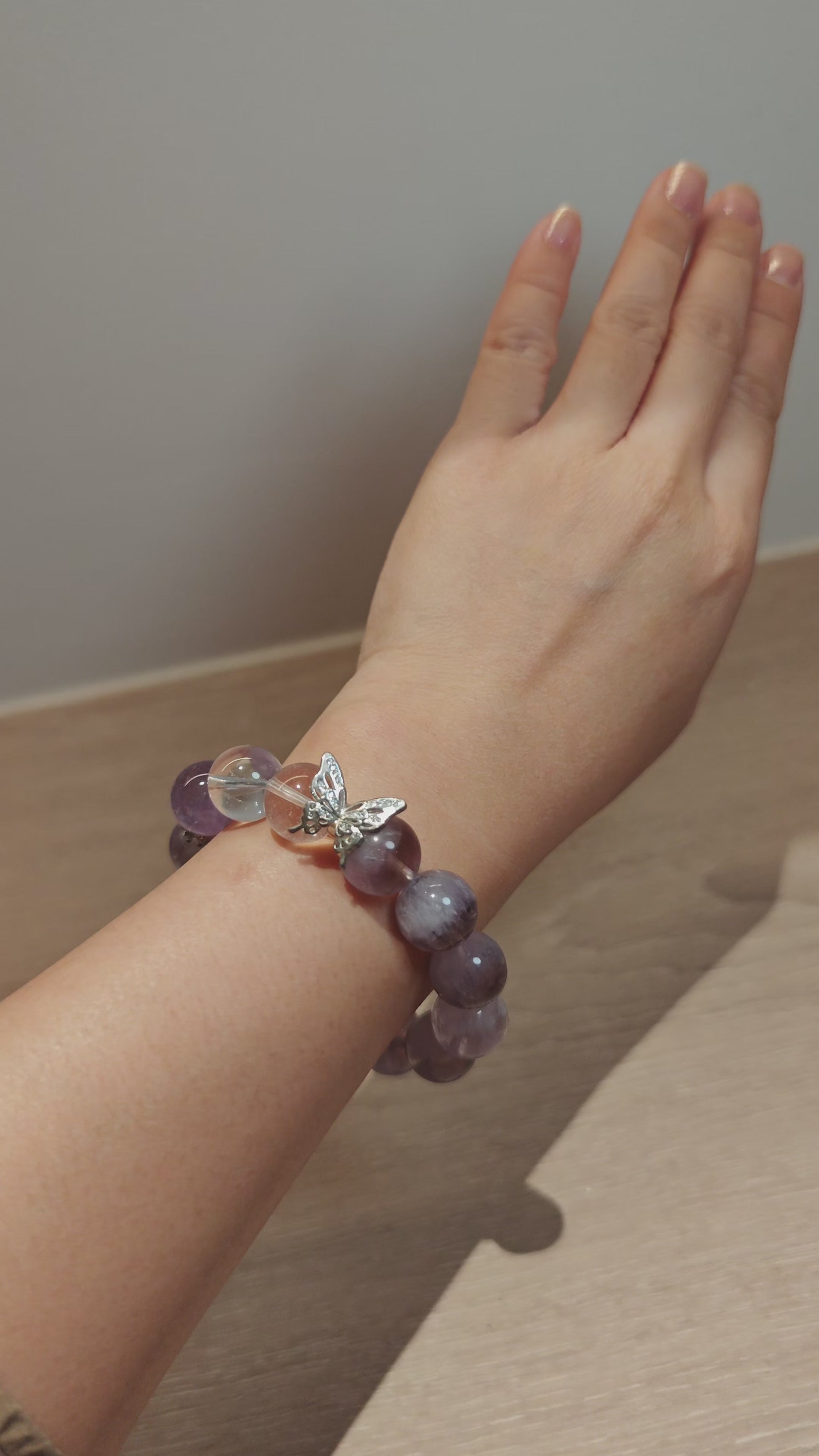 This is an artisan Purple Rabbit Hair Crystal Healing Bracelet, which is handmade with Lavender Amethyst, Clear Quartz & Butterfly Charm.